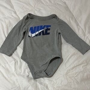 Nike Kids Bodysuit in Gray with Blue Logo